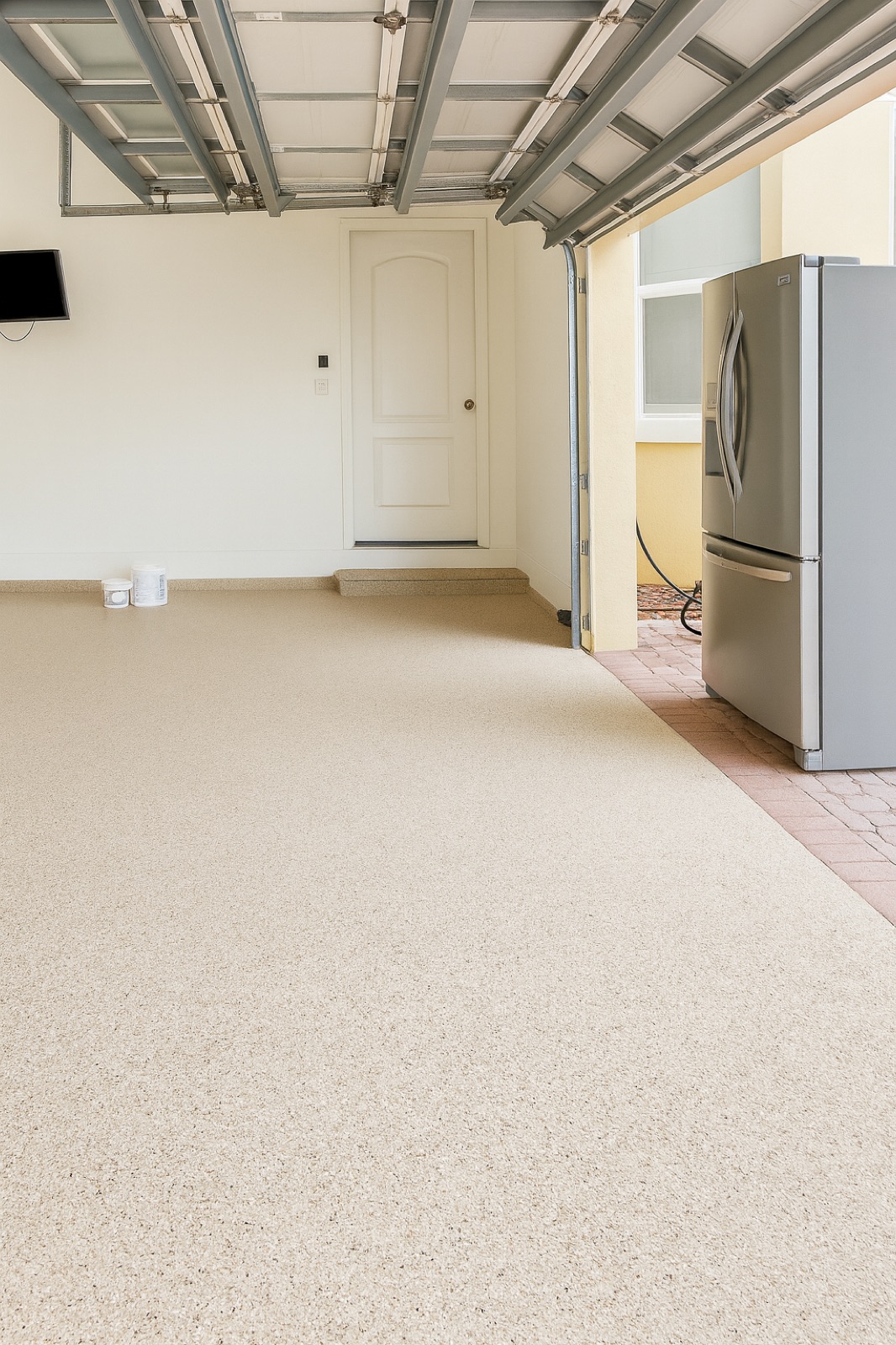 Finished garage with beige flake epoxy floor